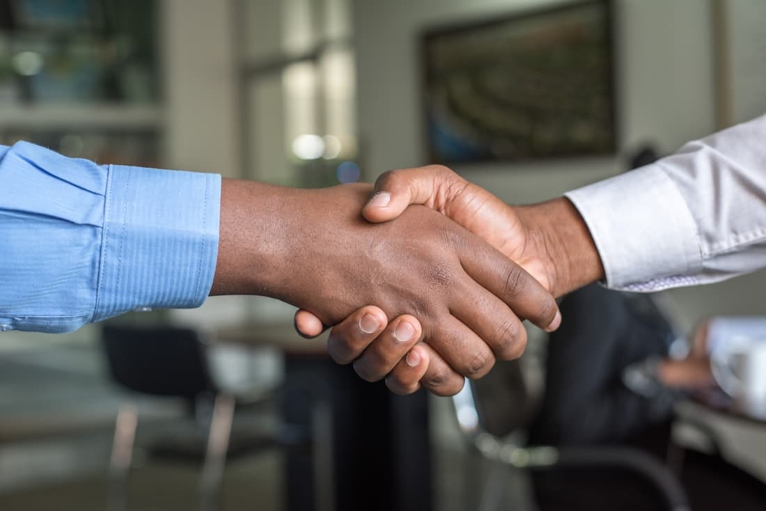 A handshake closing the offer with a new rep